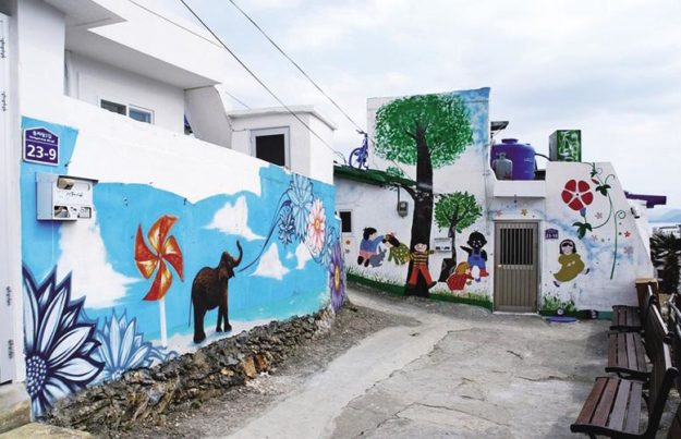 Murals on the walls of houses in Dongpirang Mural Village.